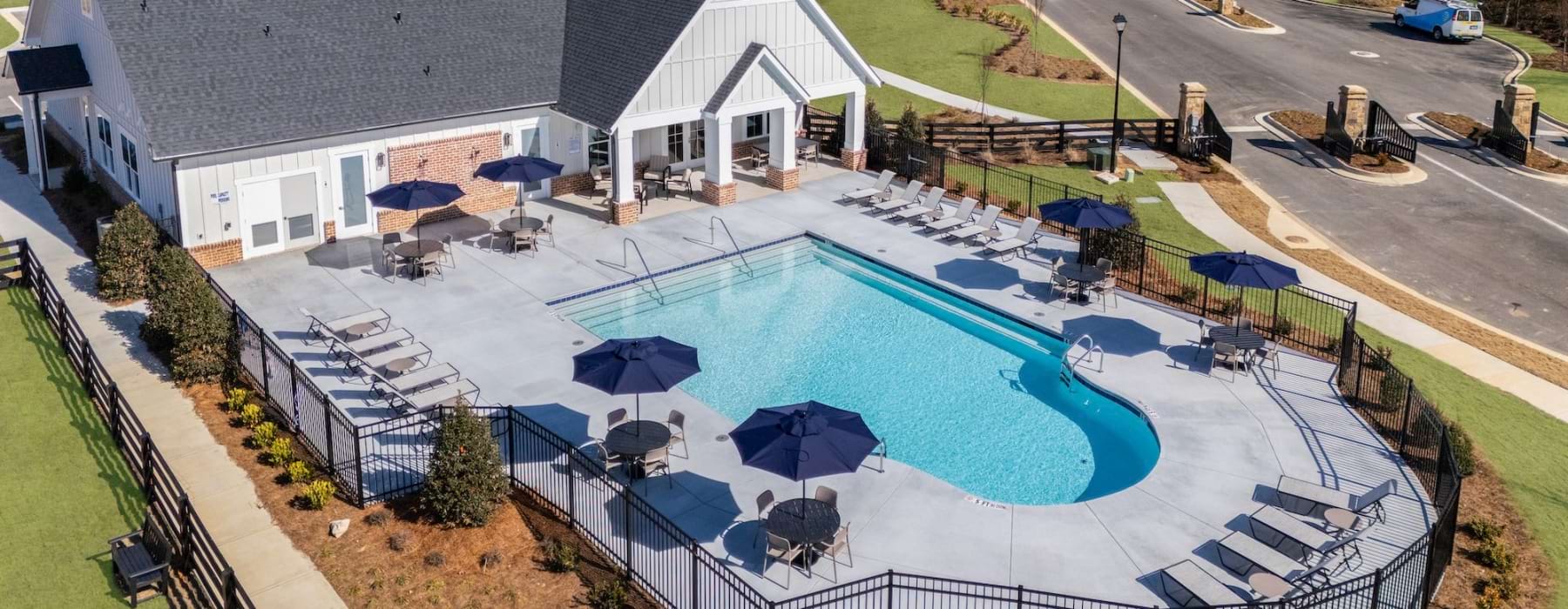 Resort-style swimming pool with lounge seating